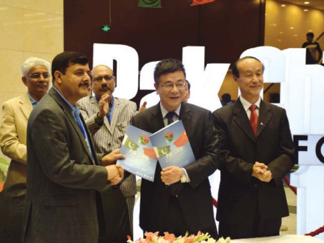 delegates at the pakistan china business forum pose for a photograph at the comsats institute of information technology photo express
