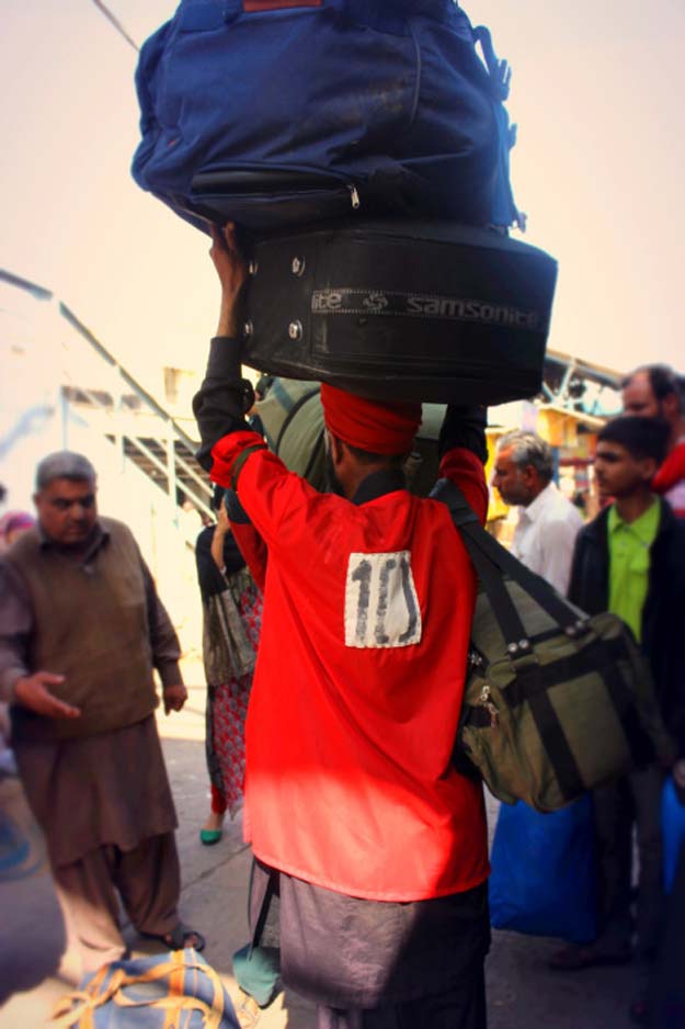 coolie number 10 lugging weight at karachi s railway station