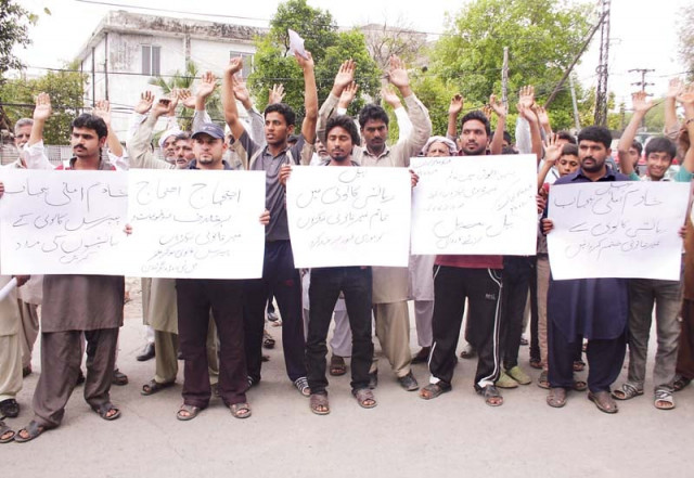 the protesters held placards and shouted slogans against the government photo abid nawaz express the protesters held placards and shouted slogans against the government photo abid nawaz express