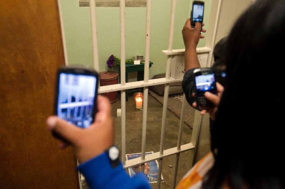 people take pictures of nelson mandela 039 s former cell at robben island photo afp