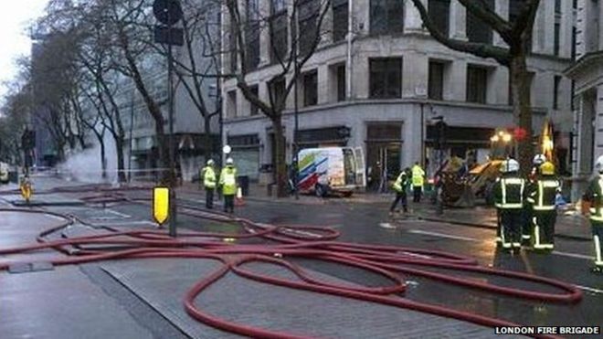 as flames erupt from manhole cover the london fire brigade sent 10 engines and 70 crew to scene photo courtesy bbc