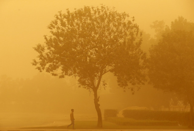 a man walks during a sand storm in dubai april 2 2015 photo reuters a man walks during a sand storm in dubai april 2 2015 photo reuters