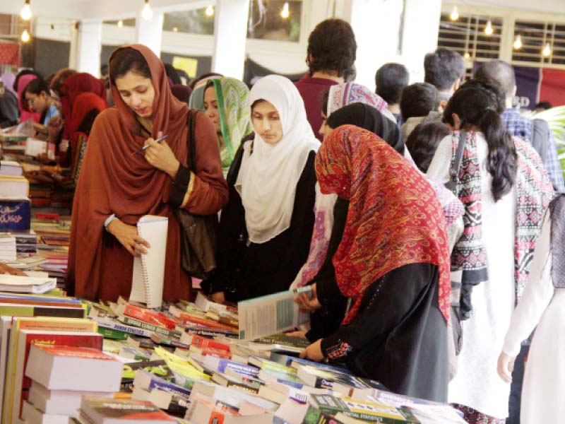 students perusing through books at the fair photo abid nawaz express