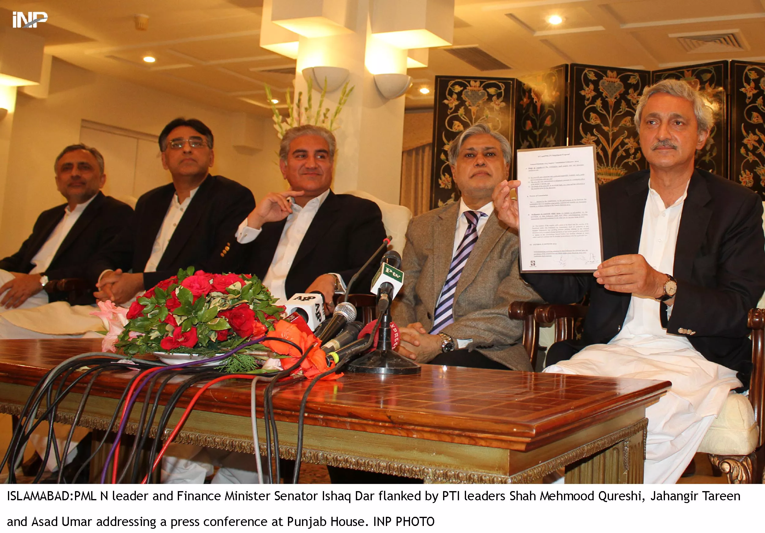 a file photo of pti general secretary jahangir tareen holds up a copy of the agreement reached between the pti and government on forming a judicial commission photo inp file a file photo of pti general secretary jahangir tareen holds up a copy of the agreement reached between the pti and government on forming a judicial commission photo inp file