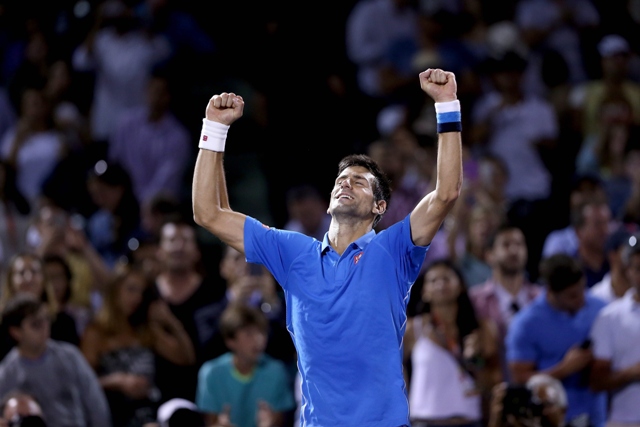 novak djokovic of serbia celebrates his win over john isner during day 12 of the miami open photo afp