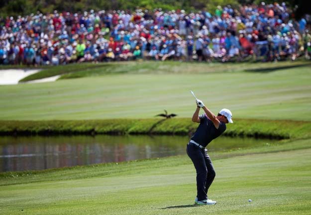 rory mcilroy of northern ireland hits an approach shot on the sixth hole during the third round of the arnold palmer invitational on march 21 2015 in orlando florida photo afp