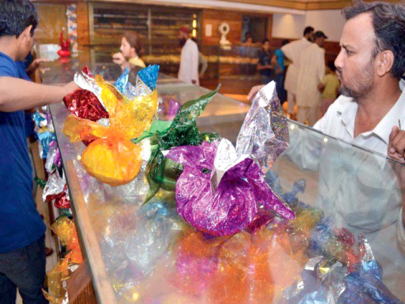 a man buys easter eggs from a bakery in saddar ahead of easter sunday photo file