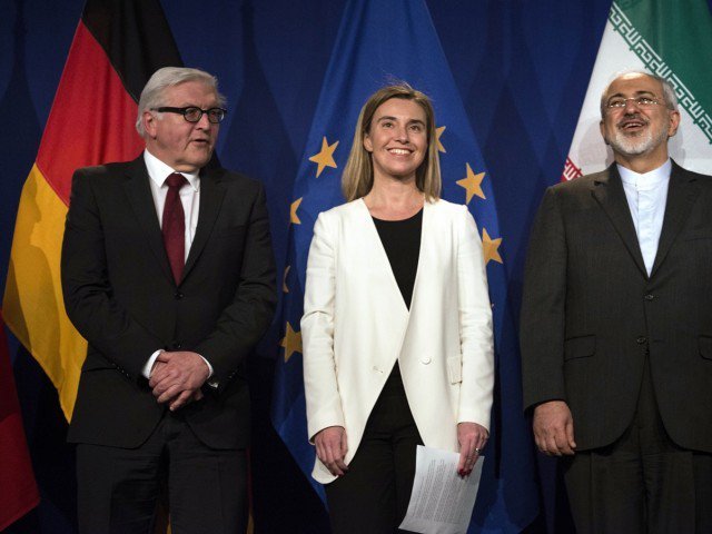 iranian foreign minister javad zarif r waits to make a statement flanked by german foreign minister frank walter steinmeier l and european union high representative for foreign affairs and security policy federica mogherini at the swiss federal institute of technology in lausanne ecole polytechnique federale de lausanne on april 2 2015 after iran nuclear program talks finished with extended sessions photo afp