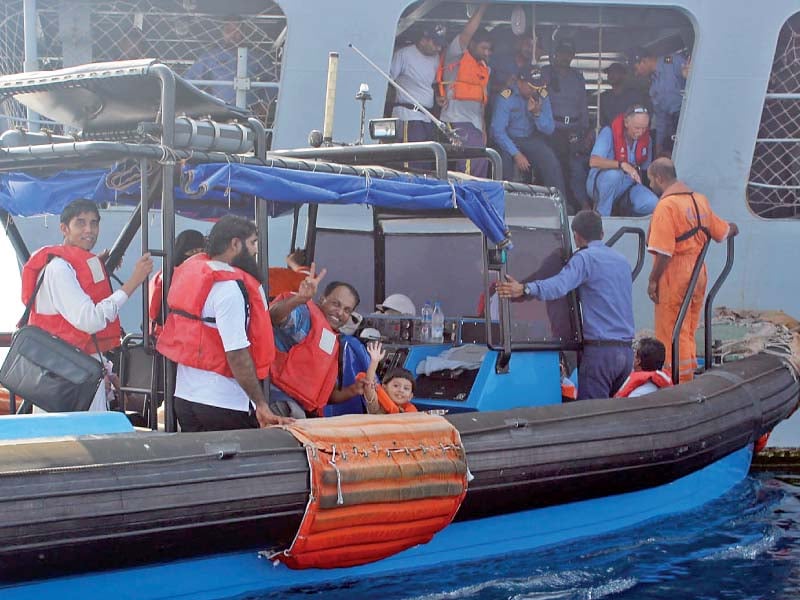 stranded pakistanis board pns aslat from a boat off the coast of the yemeni port city of mukalla photo inp