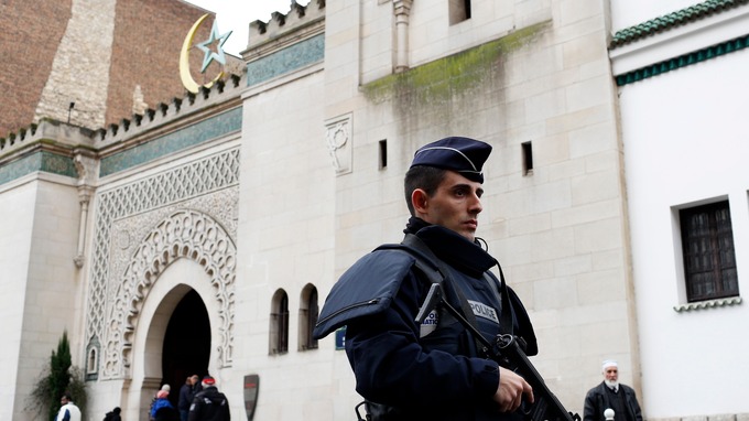 armed officers patrol outside paris mosque photo reuters