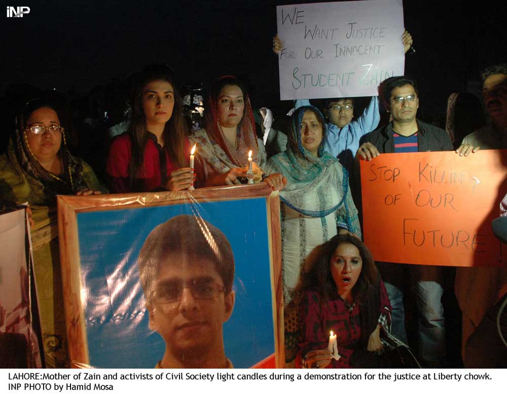 mother of zain and activists of civil society light candles during a protest for justice at liberty chowk photo inp