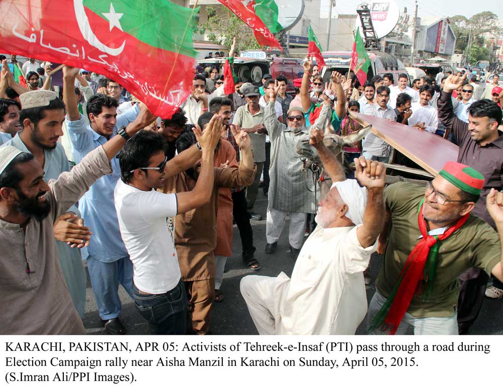 pti workers pass through a road during election campaign near aisha manzil photo ppi