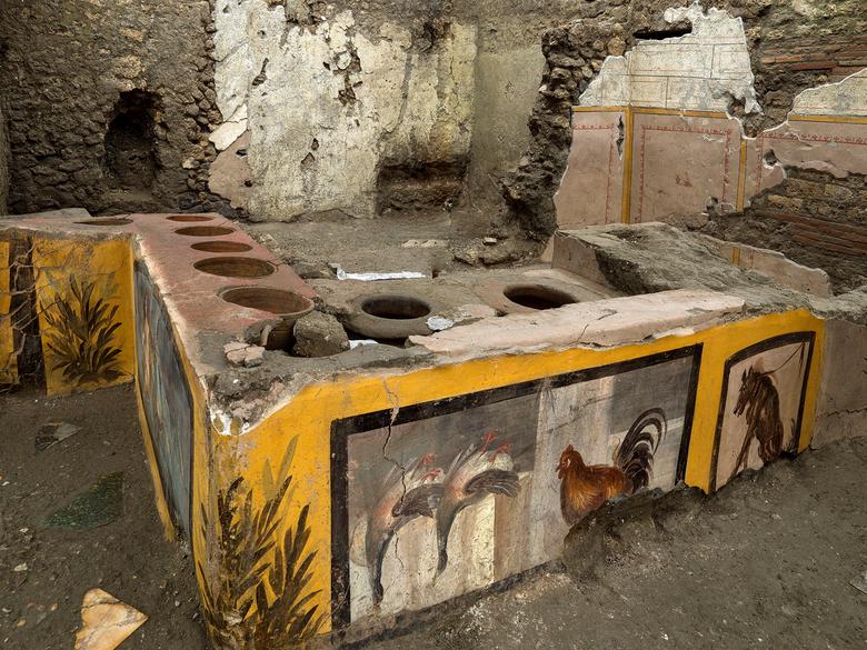 frescoes on an ancient counter discovered during excavations at pompeii italy are seen in this handout picture released december 26 2020 pompeii archaeological park ministry of cultural heritage and activities and tourism photo reuters