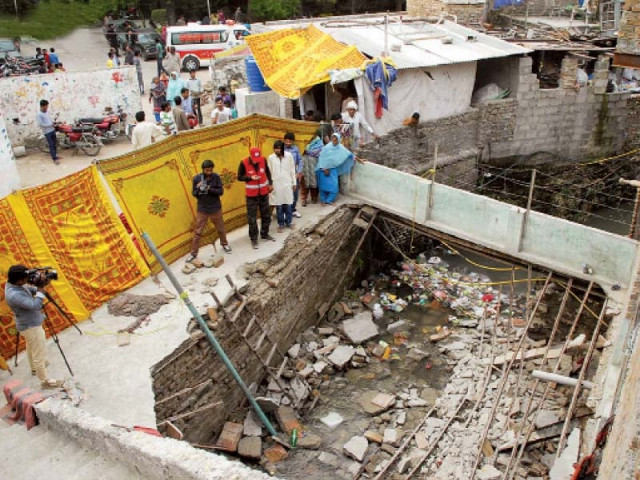 the collapsed makeshift bridge over a stream in the france colony slum in sector f 7 4 photo online