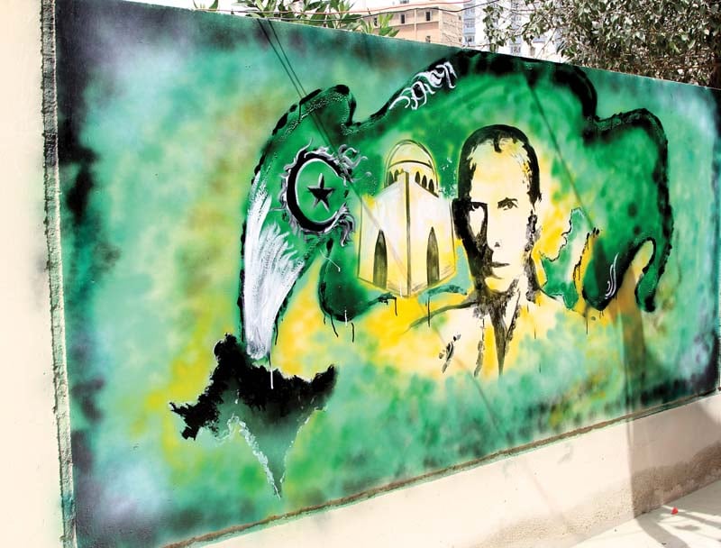 mishal khan working for an abdoz arts project painted a vivid mural depicting the quaid on a wall of the sindh madressatul islam university another inscription of the word peace was painted beside it photo aysha saleem express