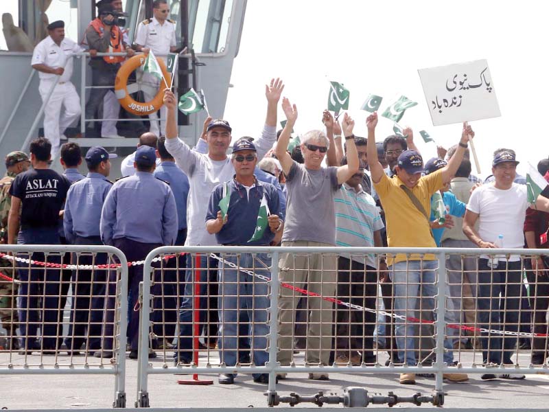 pns aslat arrives at karachi shores as the rescued people show signs of jubilation photo ppi