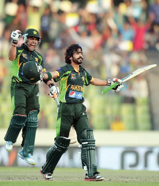 a file photo of fawad alam celebrating victory with umar akmal in the background photo afp a file photo of fawad alam celebrating victory with umar akmal in the background photo afp