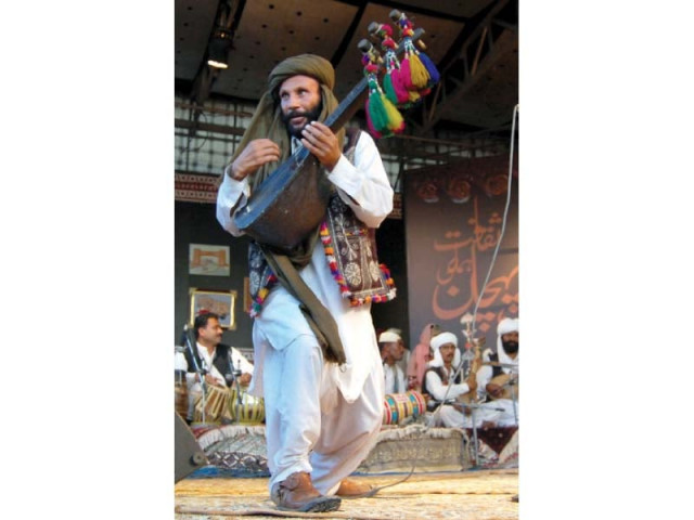 a folk artist from balochistan plays rubab at lok virsa photo express a folk artist from balochistan plays rubab at lok virsa photo express