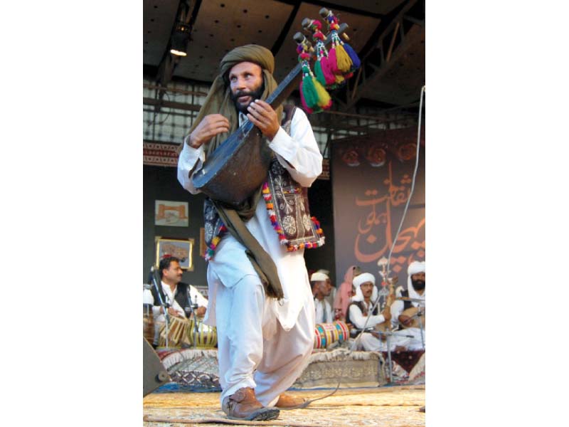 a folk artist from balochistan plays rubab at lok virsa photo express