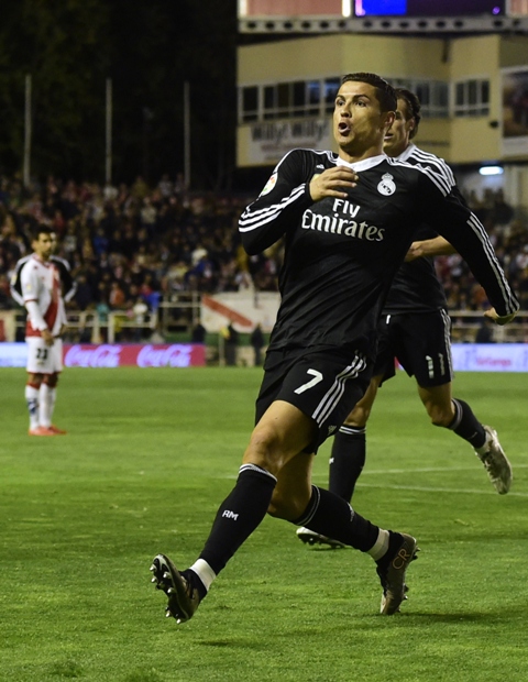 real madrid 039 s portuguese forward cristiano ronaldo celebrates a goal during the spanish league football match rayo vallecano de madrid vs real madrid cf at the estadio de vallecas in vallecas a suburb of madrid on april 8 2015 photo afp