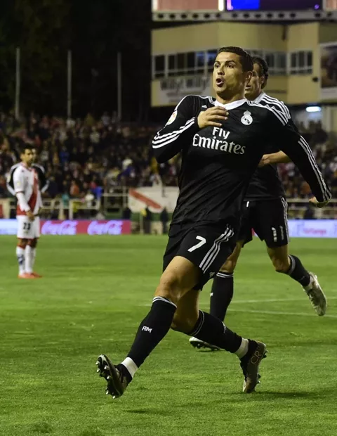 real madrid 039 s portuguese forward cristiano ronaldo celebrates a goal during the spanish league football match rayo vallecano de madrid vs real madrid cf at the estadio de vallecas in vallecas a suburb of madrid on april 8 2015 photo afp real madrid 039 s portuguese forward cristiano ronaldo celebrates a goal during the spanish league football match rayo vallecano de madrid vs real madrid cf at the estadio de vallecas in vallecas a suburb of madrid on april 8 2015 photo afp