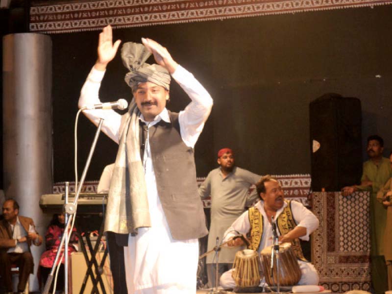 artists from khyber pakhtunkhwa present a song performance in a live event at the lok mela photo express