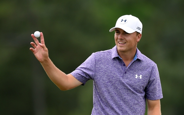 all smiles jordan spieth waves to patrons at the 18th hole as he further highlights his precocious potential photo afp