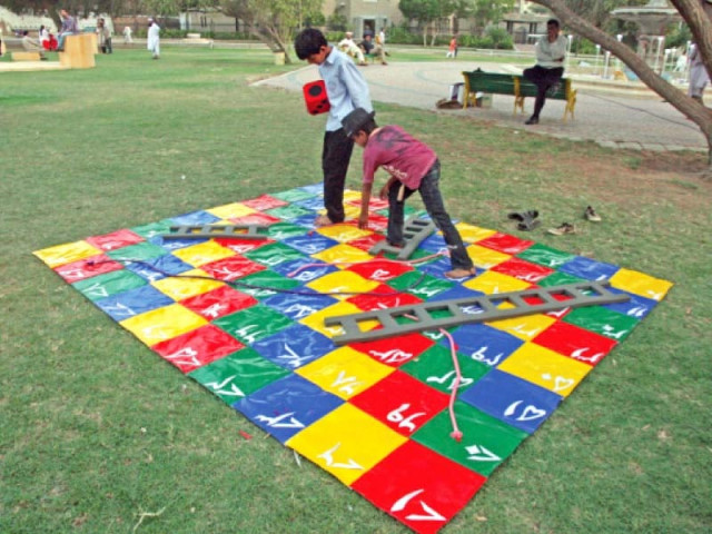 children are playing on the snakes and ladders installation at frere hall on saturday this is one of the 24 installations on display for the public at the numaish karachi urban intervention in public space photo athar khan express children are playing on the snakes and ladders installation at frere hall on saturday this is one of the 24 installations on display for the public at the numaish karachi urban intervention in public space photo athar khan express