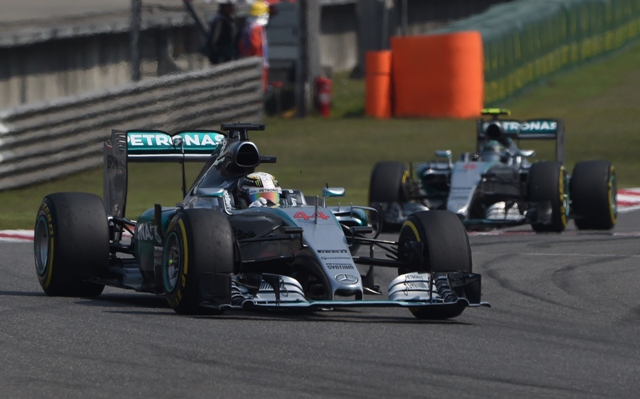 mercedes amg petronas f1 team 039 s british driver lewis hamilton l leads german teammate nico rosberg back r after the start of the formula one chinese grand prix in shanghai on april 12 2015 photo afp