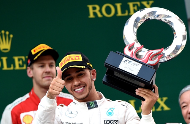ahead of the pack in a race which finished under the safety car hamilton made it two wins out of three races this year with rosberg second and ferrari 039 s sebastian vettel third photo afp