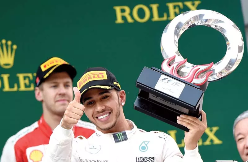 in a race which finished under the safety car hamilton made it two wins out of three races this year with rosberg second and ferrari s sebastian vettel third photo afp in a race which finished under the safety car hamilton made it two wins out of three races this year with rosberg second and ferrari s sebastian vettel third photo afp