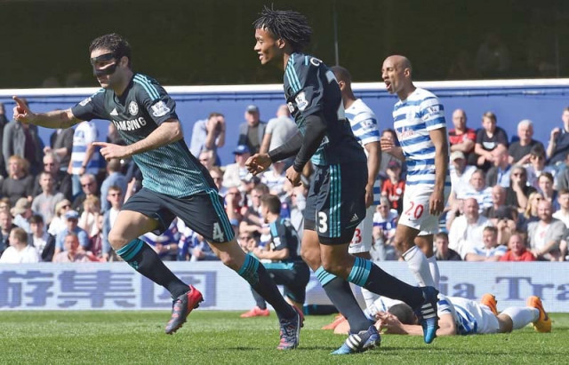 cesc fabregas wearing a protective mask cemented chelsea s hopes of winning their first title since 2010 after firing in late to give the blues a 1 0 win over qpr photo afp cesc fabregas wearing a protective mask cemented chelsea s hopes of winning their first title since 2010 after firing in late to give the blues a 1 0 win over qpr photo afp