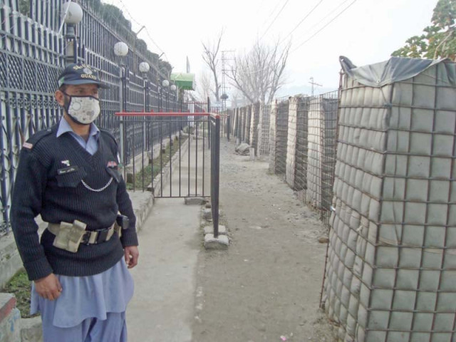 a guard stands at the gate of university of swat photo fazal khaliq express a guard stands at the gate of university of swat photo fazal khaliq express
