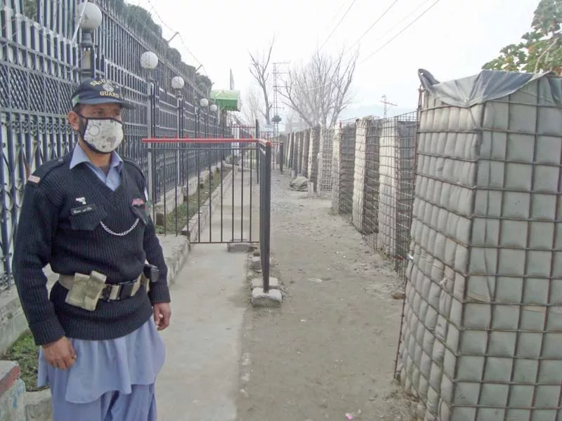 a guard stands at the gate of university of swat photo fazal khaliq express a guard stands at the gate of university of swat photo fazal khaliq express