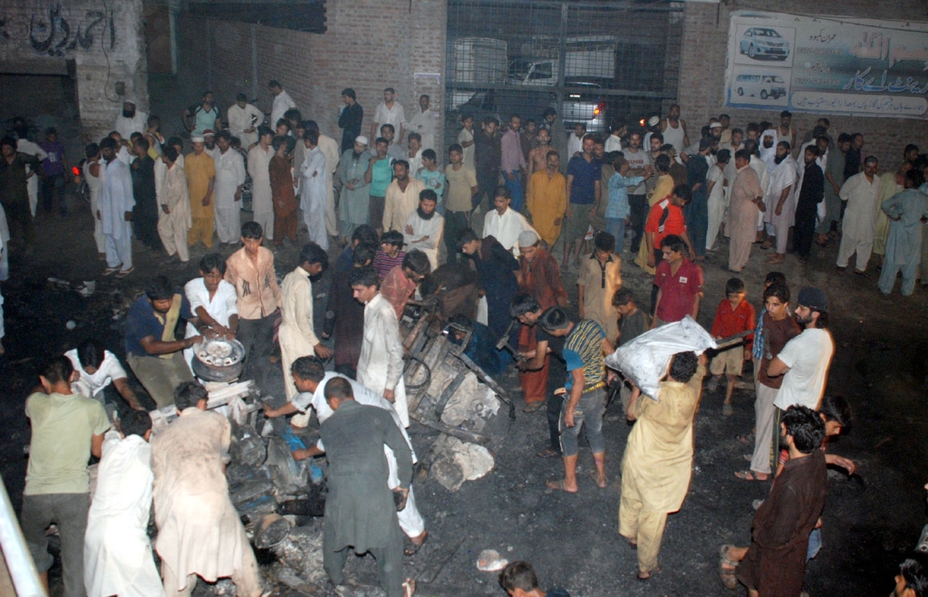 in 2014 an angry mob torched an ahmadi neighbourhood killing woman and two girls after boy posted blasphemous picture photo express khurram shahzad