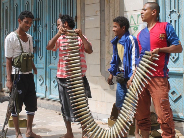 yemeni fighters opposing the huthi rebels hold a bullet belt in the northern entrance of the southern yemeni city of aden on april 8 2015 as clashes continue to rage between huthi rebels and forces loyal to fugitive yemeni president abedrabbo mansour hadi photo afp