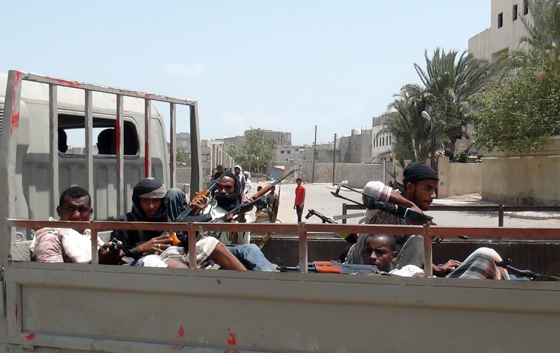 armed yemeni members of the southern separatist movement ride in the back of a truck during reported clashes with huthi rebels in the port city of aden 039 s dar saad suburb on april 14 2015 photo afp