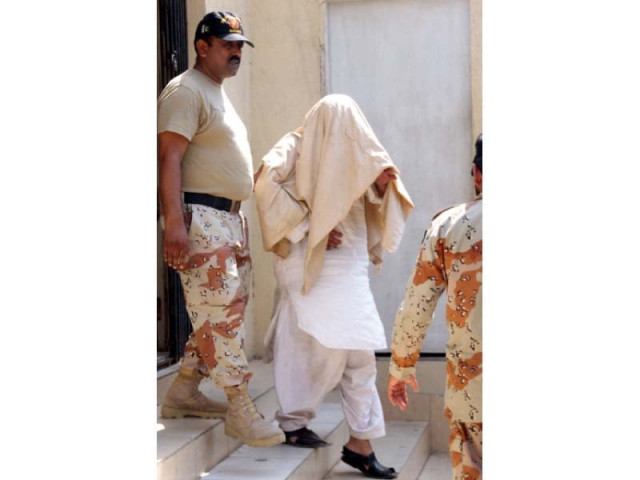 rangers personnel escort real estate businessman babar chughtai to court on tuesday photo athar khan express rangers personnel escort real estate businessman babar chughtai to court on tuesday photo athar khan express