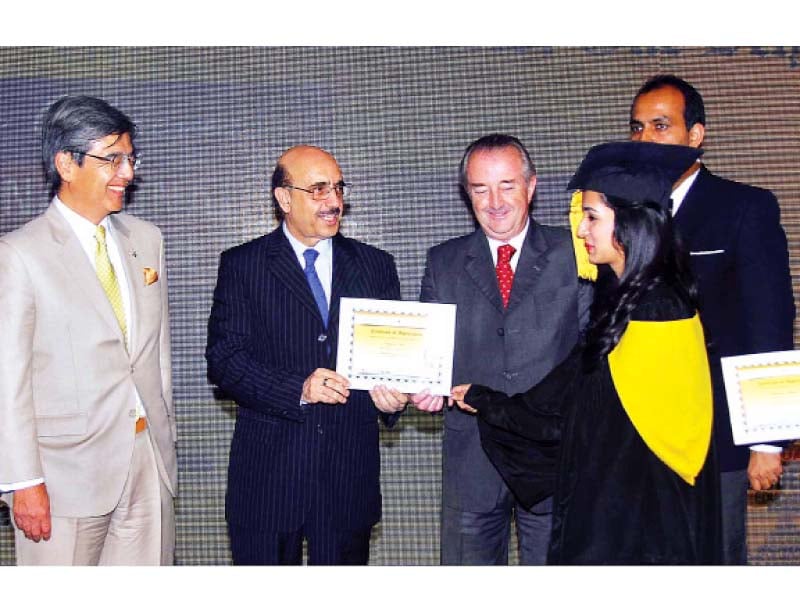 ambassador masood khan awards a certificate to a student photo express