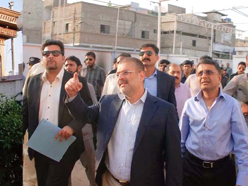 sindh lg minister sharjeel memon supervises illegal marriage halls being razed in orangi town photo express