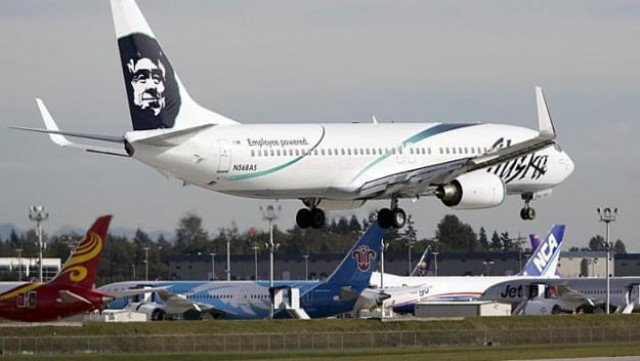 flight made an emergency landing after it took off with a worker trapped in a cargo area under the cabin photo straitstimes flight made an emergency landing after it took off with a worker trapped in a cargo area under the cabin photo straitstimes