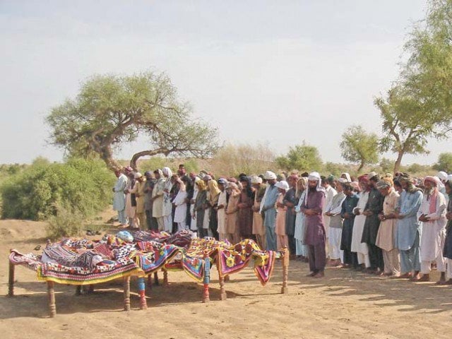 people offer funeral prayers in mithi for four of the 20 workers killed in turbat photo afp