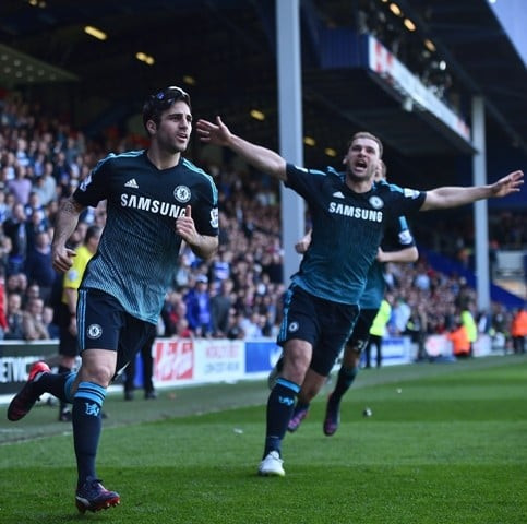 cesc fabregas scores the winner against qpr on sunday photo afp