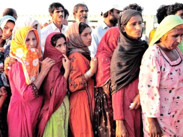 flood victims in hyderabad wait in line to get their share of relief goods photo file flood victims in hyderabad wait in line to get their share of relief goods photo file