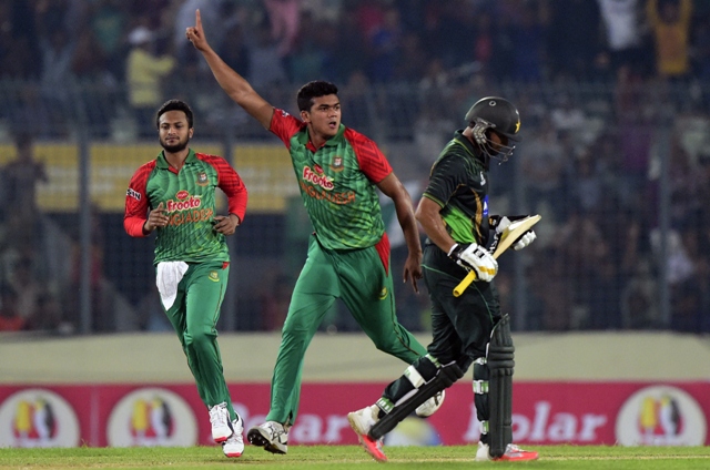 bangladesh cricketer taskin ahmed c reacts as shakib al hasan l looks on after the dismissal of pakistan cricket captain azhar ali r during the first one day international cricket match between bangladesh and pakistan at the sher e bangla national cricket stadium in dhaka on april 17 2015 photo afp