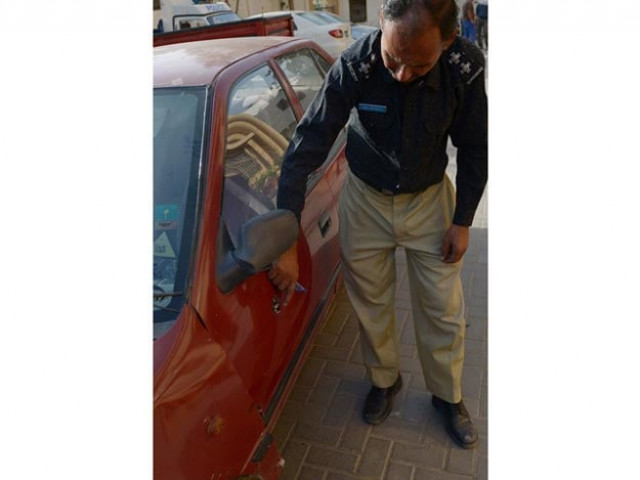a police officer inspects a vehicle inwhich a woman identified as a us national was shot in karachi on april 16 2015 photo afp a police officer inspects a vehicle inwhich a woman identified as a us national was shot in karachi on april 16 2015 photo afp