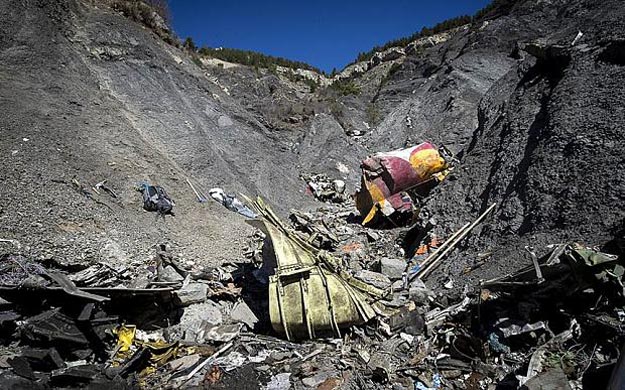 wreckage from the crashed germanwings plane lies on the mountainside photo afp