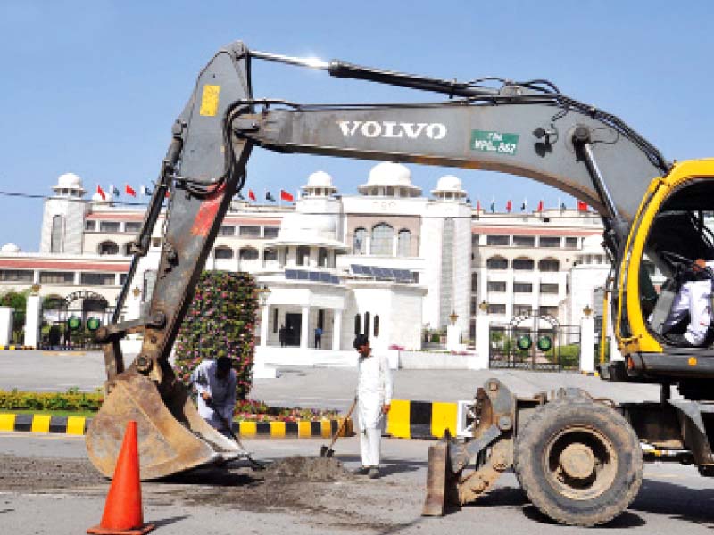 as a result of the impending visit the capital s major roads are being refurbished such as this one in front of the pm s secretariat photo online