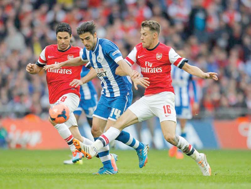 in last season s fa cup semi final against second tier wigan arsenal fell behind and only equalised in the 82nd minute before eventually securing a victory in a penalty shoot out photo afp