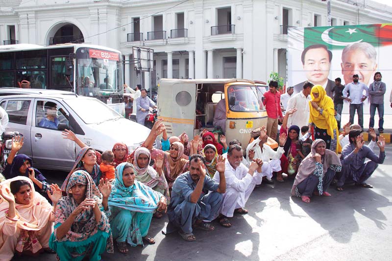 protesters staged a sit in at charing cross and blocked the traffic for several hours on friday photo shafiq malik